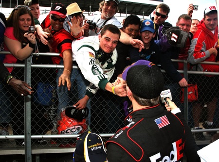 Denny Hamlin celebrates his Goody's Fast Pain Relief 500 win with his home-state fans at Martinsville Speedway. (Credit: Jerry Markland/Getty Images for NASCAR)