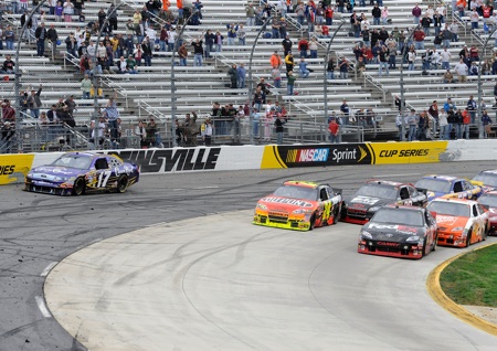 After starting the green-white-checkered finish in fourth position, Denny Hamlin pushed his way to the front of the field and took the lead when Matt Kenseth cut across the field but couldnt stay in the groove. (Credit: John Harrelson/Getty Images for NASCAR)