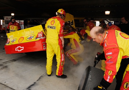 Crew members of Kevin Harvick's No. 29 Shell Pennzoil Chevrolet work on the right rear of the car after Harvick was forced to the garage during the Goody's Fast Pain Relief 500 at Martinsville Speedway. (Credit: Rusty Jarrett/Getty Images for NASCAR)