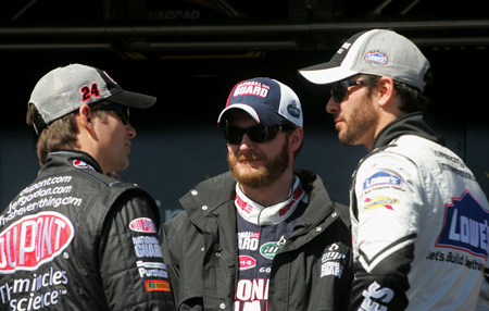 Hendrick Motorsports teammates Jeff Gordon, Dale Earnhardt Jr. and Jimmie Johnson talk during driver introductions on Sunday at Las Vegas Motor Speedway. (Credit: Jerry Markland/Getty Images for NASCAR)