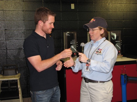 Looks like Red Bull really does give you wings. Here Brian Vickers receives his honorary astronaut wings from Aviation Challenge manager Ruth Marie Oliver (call sign: Red Bull) at the U.S. Space and Rocket Center in Huntsville, Ala. 