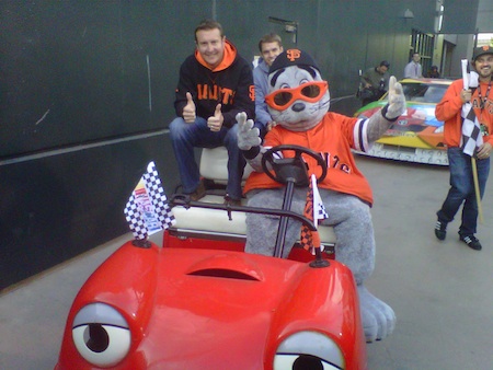 Former NASCAR Sprint Cup Series champion Kurt Busch and San Francisco Giants mascot Lou Seal pose for a quick picture in the 'pace car' before their victory lap in San Francisco on Tuesday (photo credit: NASCAR Public Relations)
