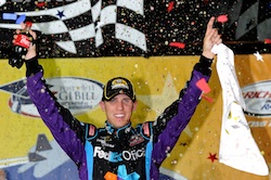 Denny Hamlin celebrates winning the Air Guard 400 at Richmond International Raceway, his second victory at his hometown track. (Credit: John Harrelson/Getty Images for NASCAR)
