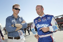 Marcos Ambrose chats with The Amazing Race host Phil Keoghan during practice for the NASCAR Sprint Cup Series Pepsi Max 400 on October 9, 2010 in Fontana, California. (Credit: Todd Warshaw/Getty Images for NASCAR)