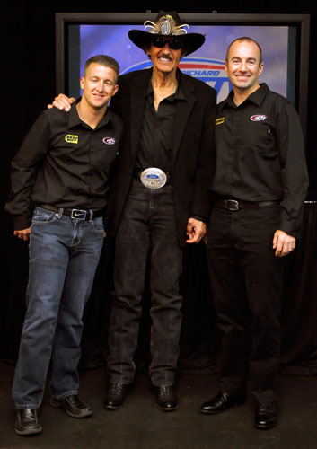 (Center) NASCAR Hall of Famer Richard Petty stands between his two NASCAR Sprint Cup Series drivers AJ Allmendinger (left) and the newest addition to Richard Petty Motorsports Marcos Ambrose during the Sprint Media Tour hosted byCharlotte Motor Speedway on Wednesday in Charlotte, N.C. (Credit: Jason Smith/Getty Images for NASCAR)