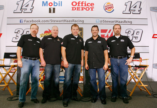 (Left to right) Bobby Hutchens, director of competition for Stewart-Haas Racing; Tony Gibson, crew chief of the No. 39 NASCAR Sprint Cup Series car; Ryan Newman, NASCAR Sprint Cup Series driver; Tony Stewart, NASCAR Sprint Cup Series owner and driver; and Darian Grubb, crew chief of the No. 14 NASCAR Sprint Cup Series car, pose for a picture during the 2011 Sprint Cup Media Tour hosted by Charlotte Motor Speedway on Monday at Stewart-Haas Racing in Kannapolis, N.C. (Credit: Jason Smith/Getty Images for NASCAR)