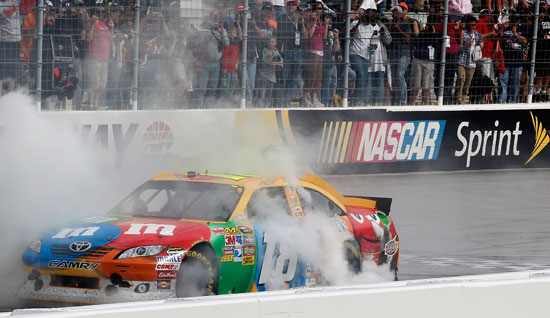 Kyle Busch performs a burnout on the front stretch after winning the Jeff Byrd 500 at Bristol Motor Speedway (Credit: Geoff Burke/Getty Images for NASCAR)