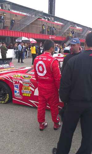 Juan Pablo Montoya waits for practice to begin. He was the only driver I could see that wasn't sitting in their car, seemed like a good idea considering they didn't get going for awhile. 