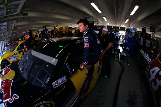 Kasey Kahne, driver of the No. 4 Red Bull Toyota, climbs in his car during practice for the NASCAR Sprint Cup Series Samsung Mobile 500 at Texas Motor Speedway on Apr. 8 in Fort Worth, Texas. (Credit: Chris Graythen/Getty Images)