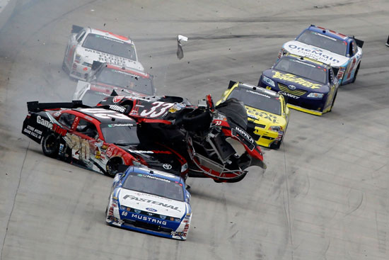 Carl Edwards leads as Joey Logano (No. 20) collides with Clint Bowyer (No. 33) at the end of the NASCAR Nationwide Series 5-hour Energy 200 on Saturday at Dover International Speedway in Dover, Del. (Credit: Todd Warshaw/Getty Images for NASCAR)