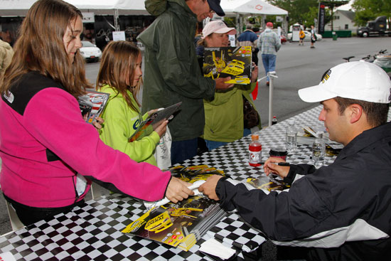 Reed Sorenson meets young fans on Saturday morning during a NASCAR Nationwide Series autograph session at the official NASCAR Merchandise Hauler at Dover International Speedway in Dover, Del. (Credit: Todd Warshaw/Getty Images for NASCAR)