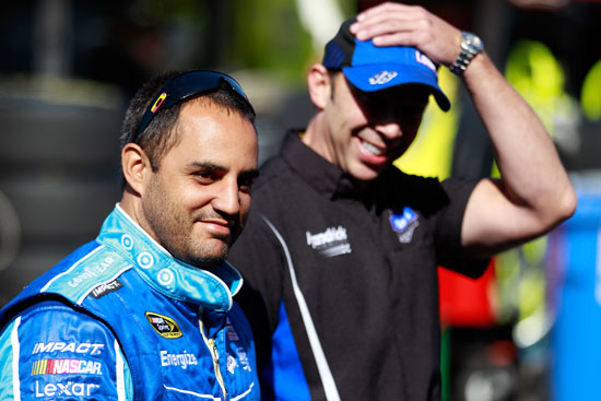 Juan Pablo Montoya shares a laugh with No. 48 crew chief Chad Knaus during NASCAR Sprint Cup Series practice on Saturday at Infineon Raceway in Sonoma, Calif. (Credit: Chris Graythen/Getty Images)