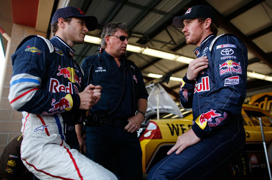 (Left to right) Kasey Kahne listens to No. 83 crew chief Ryan Pemberton and driver Brian Vickers during a Red Bull Racing garage powwow during NASCAR Sprint Cup Series practice Saturday at Infineon Raceway in Sonoma, Calif. (Credit: Tom Pennington/Getty Images)