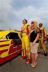 Kurt Busch, driver of the #22 Shell/Pennzoil Dodge, stands with Patricia Driscoll prior to the NASCAR Sprint Cup Series Heluva Good! Sour Cream Dips 400 at Michigan International Speedway on June 19, 2011 in Brooklyn, Michigan. (Photo by Jason Smith/Getty Images for NASCAR) 