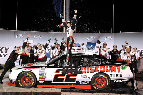 Brad Keselowski and the No. 22 Discount Tire team celebrate winning the Feed the Children 300 at Kentucky Speedway  (Credit: Tom Whitmore/Getty Images for NASCAR)