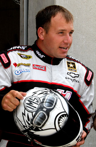 Ryan Newman, driver of the No. 39 Haas Automation Chevrolet, inspects his helmet during practice for the NASCAR Sprint Cup Series Brickyard 400 at Indianapolis Motor Speedway on July 29 in Indianapolis, Ind. (Credit: Jerry Markland/Getty Images for NASCAR)