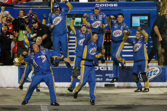 The No. 2 Penske Racing crew celebrates its third win of the season as Brad Keselowski crosses the finish line first in the NASCAR Sprint Cup Series Irwin Tools Night Race at Bristol Motor Speedway on Saturday. (Credit: Chris Graythen/Getty Images)