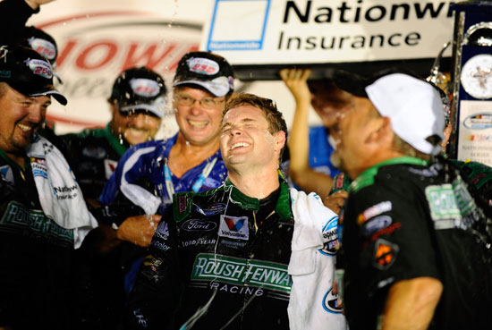 Ricky Stenhouse Jr. (center), driver of the No. 6 RickyvsTrevor.com Ford, celebrates with crew members in Victory Lane after winning the NASCAR Nationwide Series U.S. Cellular 250 at Iowa Speedway on Aug. 6 in Newton, Iowa. (Credit: Jason Smith/Getty Images for NASCAR)