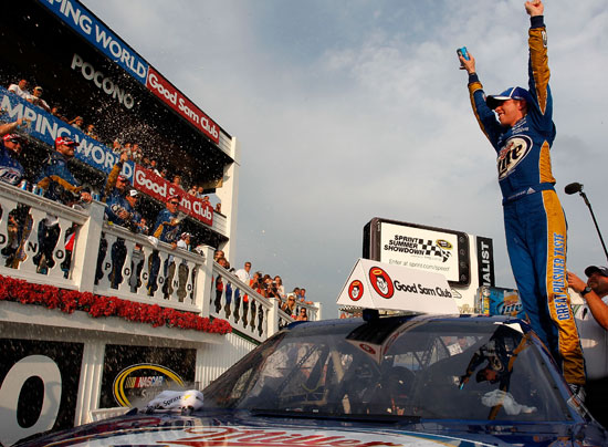 Brad Keselowski, driver of the No. 2 Miller Lite Dodge, celebrates in Victory Lane after winning the NASCAR Sprint Cup Series Good Sam RV Insurance 500 at Pocono Raceway on Aug. 7 in Long Pond, Pa. (Credit: Geoff Burke/Getty Images for NASCAR)