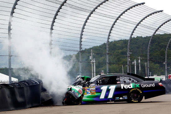 Denny Hamlin crashes the No. 11 FedEx Ground Toyota into the tire barrier after an incident in the NASCAR Sprint Cup Series Heluva Good! Sour Cream Dips at the Glen at Watkins Glen International on Aug. 15 in Watkins Glen, N.Y. (Credit: Jeff Zelevansky/Getty Images for NASCAR)