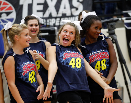 Byron Nelson High School cheerleaders react after seeing five-time NASCAR Sprint Cup Series champion Jimmie Johnson during a Texas football-style pep rally at Byron Nelson High School on Wednesday in Trophy Club, Texas. (Credit: Tom Pennington/Getty Images for Texas Motor Speedway)