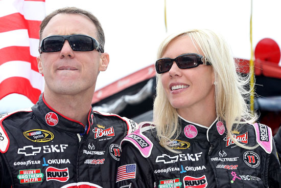 Kevin and DeLana Harvick stand on pit road before the start of the NASCAR Sprint Cup Series AAA 400 on Sunday at Dover International Speedway in Dover, Del. Kevin would end the day with the points lead in the Chase for the NASCAR Sprint Cup. (Credit: Tom Whitmore/Getty Images for NASCAR)