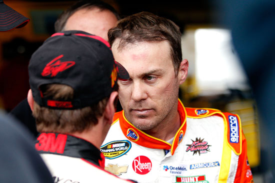 (Left to right) NASCAR Sprint Cup Series drivers Greg Biffle and Kevin Harvick talk in the garage after the two drivers made contact on the track during practice on Saturday at Martinsville Speedway. (Credit: Geoff Burke/Getty Images for NASCAR)
