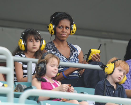 Michelle Obama watches the Ford 400 action at Homestead-Miami Speedway after meeting with families of soliders for Joining Forces. (Credit: Larry Marano/Getty Images)