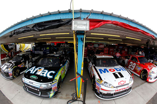 (Left to right) The cars of Chase for the NASCAR Sprint Cup contenders Jimmie Johnson, Carl Edwards, Tony Stewart and Kevin Harvick are parked in the garage next to each other during practice for the NASCAR Sprint Cup Series Kobalt Tools 500 at Phoenix International Raceway on Friday in Avondale, Ariz. (Credit: Jonathan Ferrey/Getty Images)