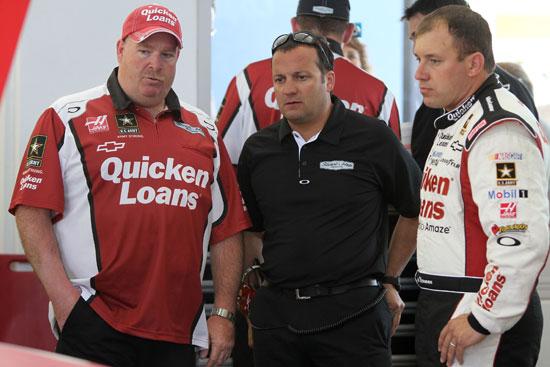 (Right to left) Ryan Newman, Stewart-Haas Racing competition director Greg Zipadelli and No. 39 crew chief Tony Gibson talk during NASCAR Sprint Cup Series practice on Saturday at Las Vegas Motor Speedway in Las Vegas, Nev. (Credit: Jerry Markland/Getty Images for NASCAR)