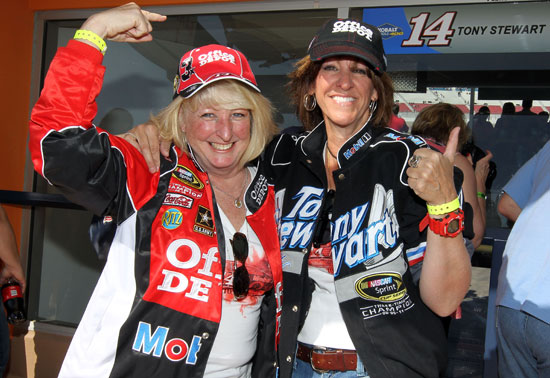 Two Tony Stewart fans are happy the three-time and defending champion turned the third-fastest lap in practice Friday at Las Vegas Motor Speedway in Las Vegas, Nev. (Credit: Jeff Bottari/Getty Images for NASCAR)