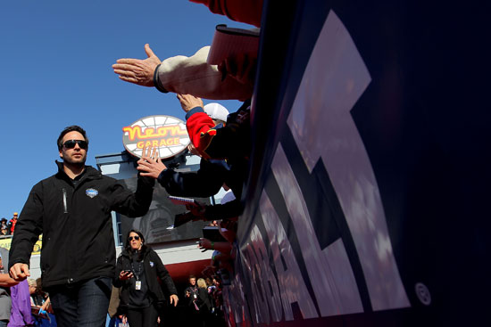 Four-time Las Vegas Motor Speedway race winner Jimmie Johnson greets fans on the way to the drivers' meeting in the Neon Garage at the track before the NASCAR Sprint Cup Series Kobalt Tools 400 on Sunday at Las Vegas Motor Speedway in Las Vegas, Nev. (Credit: Justin Edmonds/Getty Images for NASCAR)