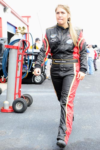 Johanna Long walks through the garage prior to practice for the Aaron's 312 at her home track, Talladega Superspeedway. (Credit: John Harrelson/Getty Images for NASCAR)