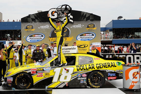 Joey Logano, driver of the No. 18 Dollar General Toyota, celebrate sin Victory Lane after winning the NASCAR Nationwide Series Alliance Truck Parts 250 at Michigan International Speedway on Saturday in Brooklyn, Mich. (Credit: John Harrelson/Getty Images for NASCAR)