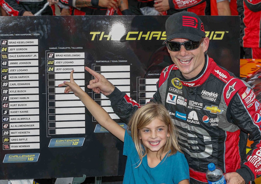 Jeff Gordon, driver of the #24 Drive To End Hunger Chevrolet SS celebrates his victory with his daughter, Ella Sofia Sunday, September 28, 2014 in the Chase Challenger 16 NASCAR Sprint Cup race at Dover International Speedway in Dover, Delaware. Gordon advances to the Contender 12 phase of the Chase which begins next Sunday at Kansas Speedway.  (Photo by Gregg Ellman/HHP for Chevy Racing)