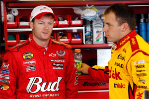 Dale Earnhardt Jr. (left) talks with Ryan Newman after practice at Watkins Glen International. (Photo Credit: John Harrelson/Getty Images for NASCAR)