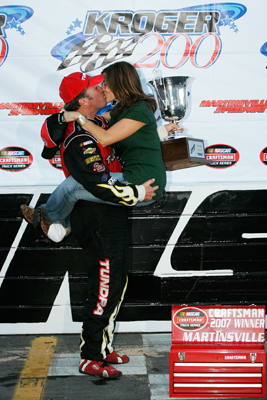Mike Skinner, driver of the #5 Toyota Tundra Toyota, kisses his wife, Angela after winning the NASCAR Craftsman Truck Series Kroger 200 at Martinsville Speedway on October 20, 2007 in Martinsville, Virginia. (Photo by Jason Smith/Getty Images for NASCAR)