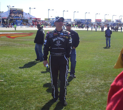 Clint Bowyer watches The Blue Man Group perform before the start of the UAW-Dodge 400 in Las Vegas (Photo Credit: The Fast and the Fabulous/Valli Hilaire)