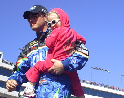 J.J. Yeley and his adorable daughter Faith exit the stage during driver introductions at the UAW-Dodge 400 in Las Vegas (Photo Credit: The Fast and the Fabulous/Valli Hilaire)