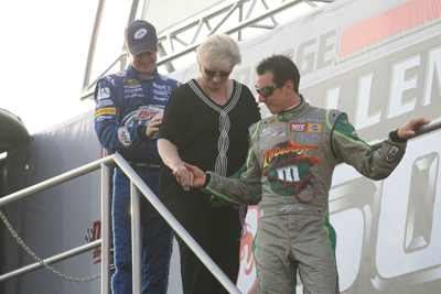 Kurt (left) and Kyle (right) help their mother Gaye (center) off of the stage before the Dodge Challenger 500 at Darlington Raceway (Photo Credit: Jerry Markland/Getty Images for NASCAR)