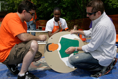Tony Stewart, NASCAR Sprint Cup Series driver of the #20 Home Depot Racing car & two-time Series Champion and Greg Biffle, NASCAR Sprint Cup Series driver of the #16 3M Racing car help build a build a racing-themed playground in just one day at Elon Homes for Children (Photo Credit: CIA for KaBOOM)