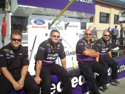 Crew members from the No. 38 FreeCreditReport.com Ford Fusion team
