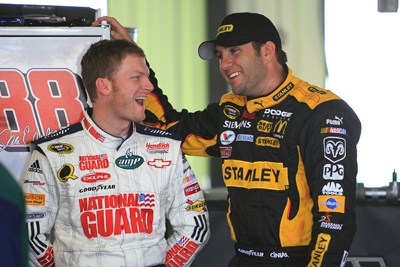 Dale Earnhardt Jr. and Elliott Sadler share a laugh in the garage during Friday's practice at Pocono Raceway (Photo Credit: Jerry Markland/Getty Images for NASCAR)