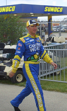 Clint Bowyer walks to the Dollar General 300 drivers and crew chiefs meeting at Chicagoland Speedway on Friday, July 11, 2008 (photo credit: The Fast and the Fabulous