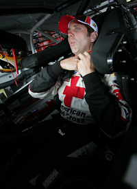 Biffle straps himself into the #16 Ford Fusion to prepare for the start of the Aaron's 499 in Talladega. (Photo courtesy American Red Cross/Red Cross Racing)