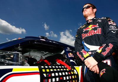 Pole sitter for the 3M Performance 400 Presented by Bondo and driver of the No. 83 Red Bull Toyota Brian Vickers stands next to his car during pre-race activities Sunday. (Photo Credit: Jason Smith/Getty Images for NASCAR)
