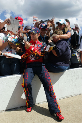 Fans crowd around Jeff Gordon, driver of the No. 24 Dupont Chevrolet, during qualifying Friday at Michigan International Speedway (Photo Credit: Ronald Martinez/Getty Images)