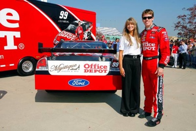 (September 26, 2008): NASCAR star and current Sprint Cup Series point leader Carl Edwards and Julie Catalano of Boise, Idaho, stand next to her company's logo on the No. 99 Office Depot Ford