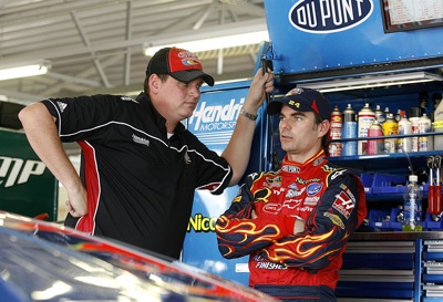 Steve Letarte, crew chief for the No. 24 DuPont Chevrolet, talks with his driver, Jeff Gordon, during practice Friday at Kansas Speedway. Gordon, who qualified 13th, was able to practice and qualify despite not feeling well all day. (Photo Credit: Jason Smith/Getty Images for NASCAR)