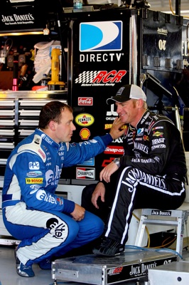 Ryan Newman, driver of the No. 12 alltel Dodge, talks to Clint Bowyer, driver of the No. 07 Jack Daniel's Chevrolet, in the garages of Kansas Speedway during Friday's practice. Both drivers will start in the middle of the pack on Sunday for the NASCAR Sprint Cup Series Camping World RV 400 (Newman at 15th and Bowyer at 24th). (Photo Credit: Matthew Stockman/Getty Images)